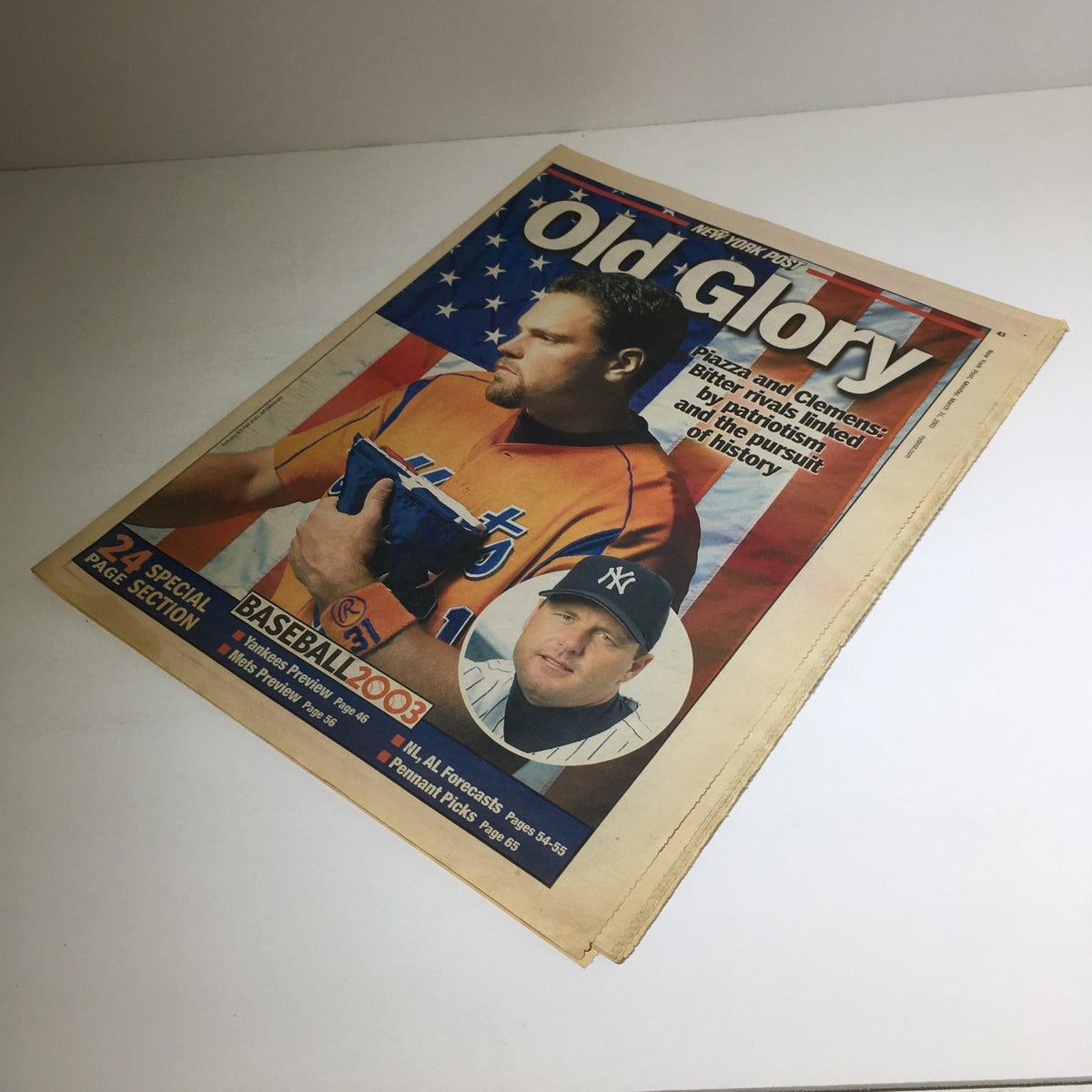 New York Post: March 31 2003 cover of Old Glory, highlighting baseball themes and featuring notable players Piazza and Clemens against an American flag.