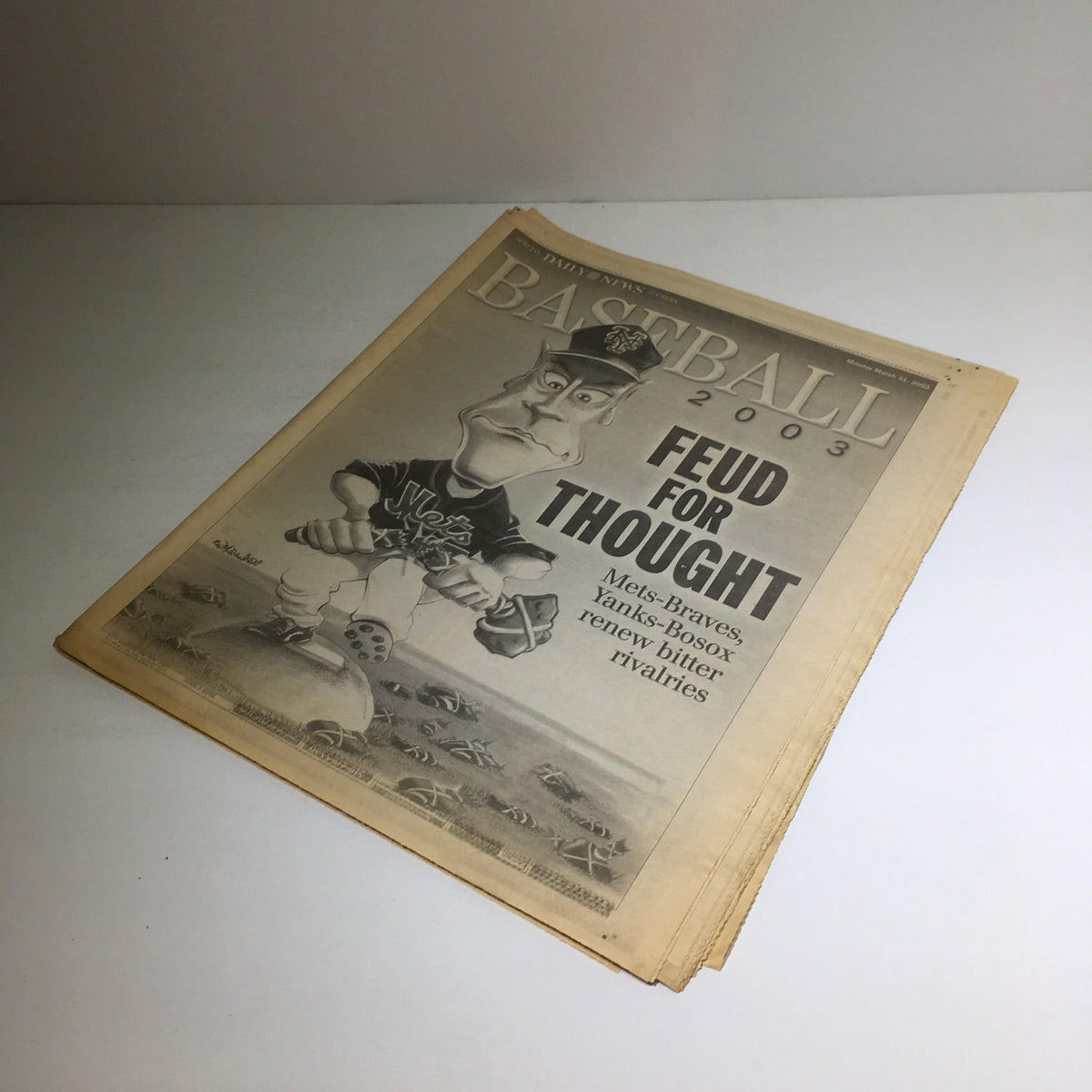 Cover of the New York Daily News dated March 31 2003 showcasing the title 'Feud For Thought' with a cartoon-style illustration of a baseball player.
