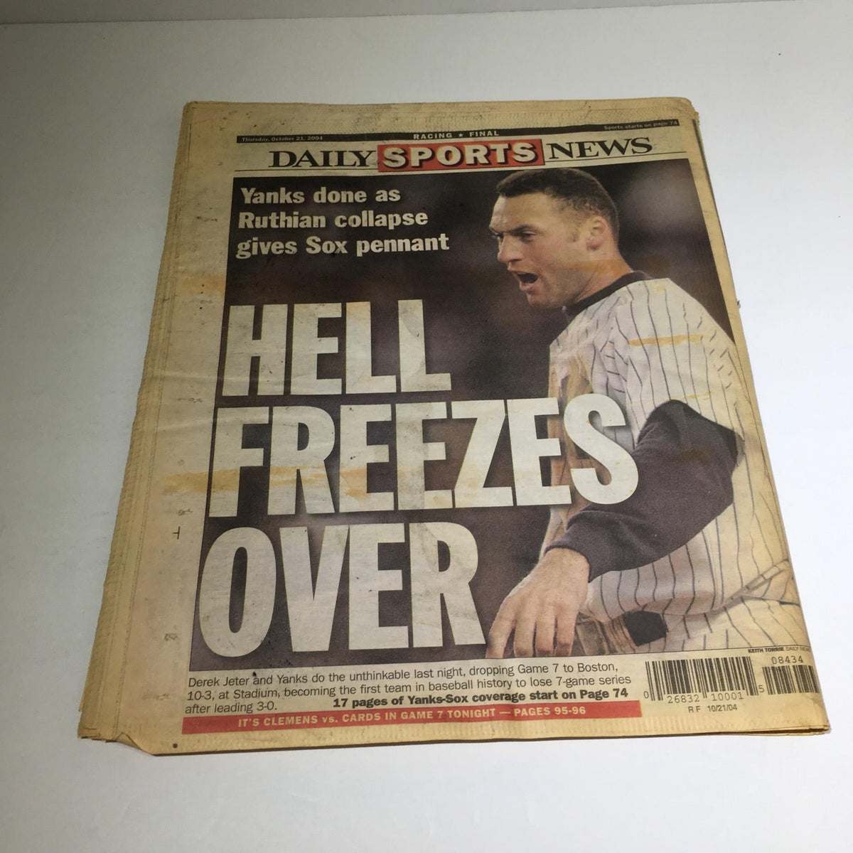 October 21, 2004 New York Daily News cover with the headline 'Hell Freezes Over', encapsulating the moment when the Yankees lost to the Red Sox, a significant event in sports history.