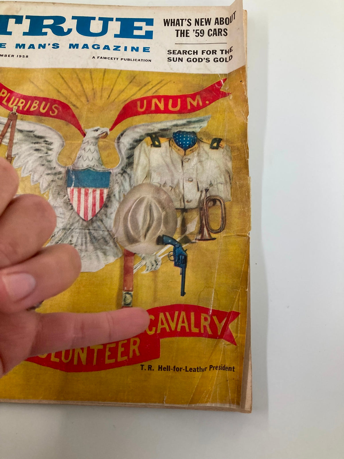 Close-up view of TRUE The Man's Magazine November 1958 cover, highlighting T.R. Hell-for-Leather with military symbols and volunteer cavalry banner.