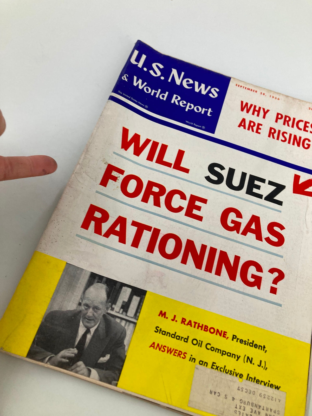 Close-up view of the US News & World Report Magazine cover from September 28, 1956, highlighting the question 'Will Suez Force Gas Rationing?' and featuring M.J. Rathbone.