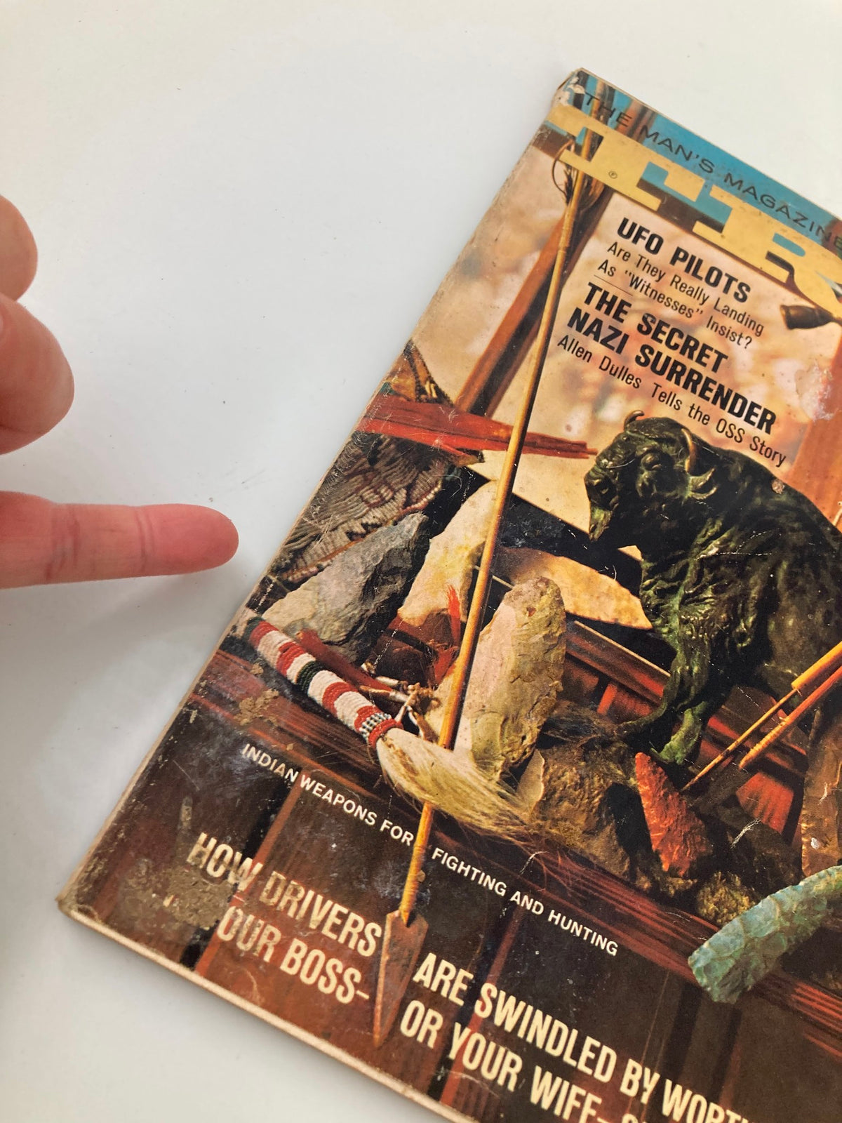 Close-up view of the cover of TRUE The Man's Magazine February 1967, highlighting details of Indian Weapons for Fighting, including decorative elements and intriguing headlines.