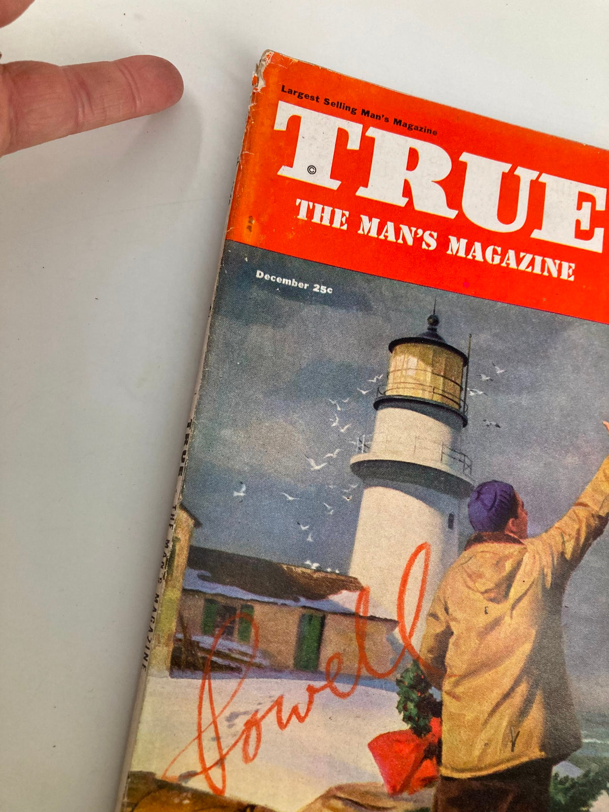 Close-up of the cover of TRUE The Man's Magazine December 1949 showing the Christmas scene, with a signature and details of the magazine.