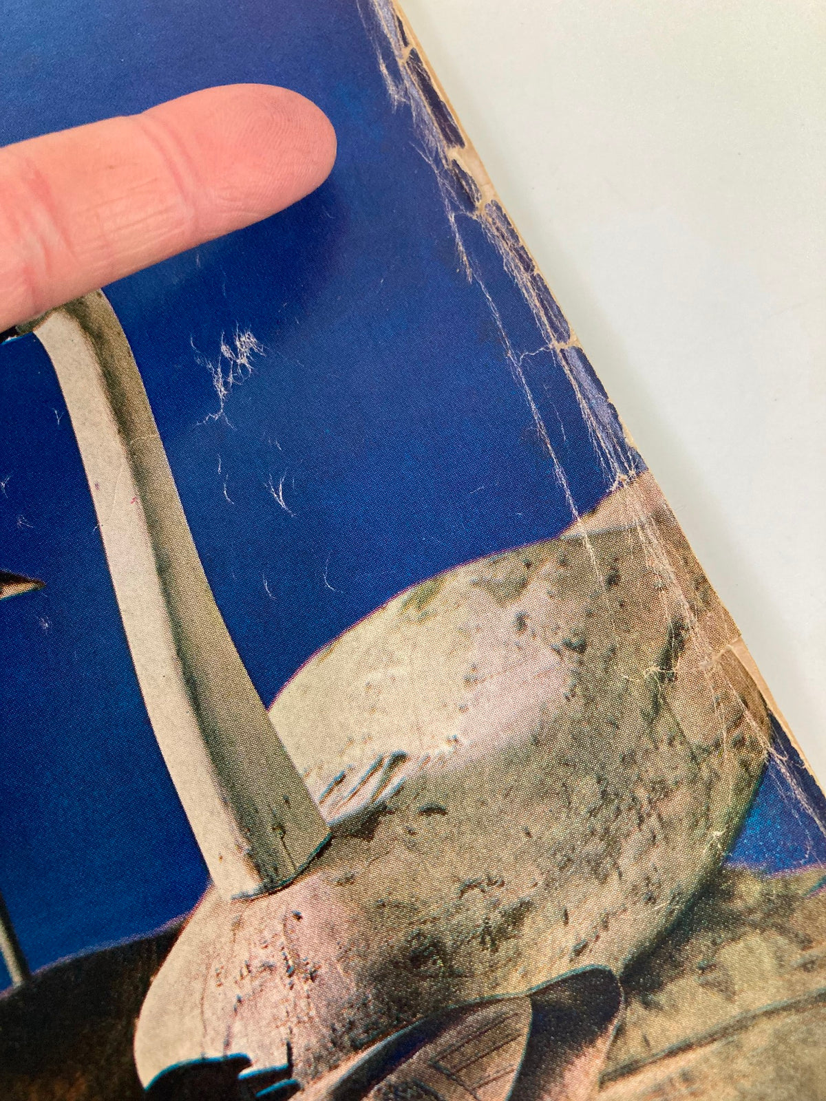 Close-up of the edge of the cover of TRUE The Man's Magazine November 1964, pointing out vintage wear and distinct characteristics from history.