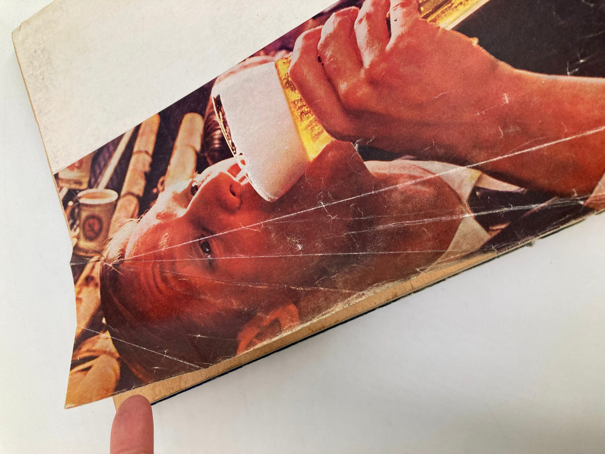 Close-up of the cover edge of TRUE The Man's Magazine, April 1966, showing wear and tear, with a focus on the vintage design and condition details.