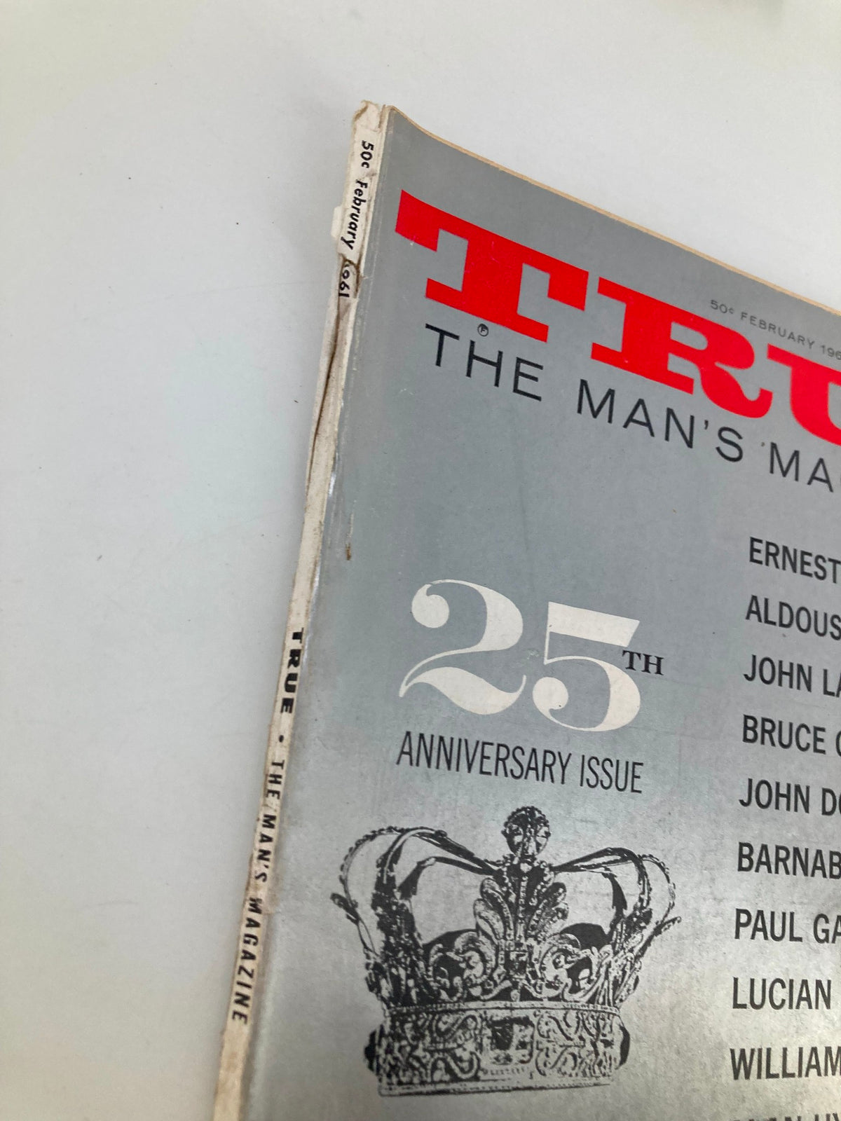 Side view of TRUE The Man's Magazine February 1961, showcasing the spine and vintage condition with the designation '25th Anniversary Issue' clearly visible.
