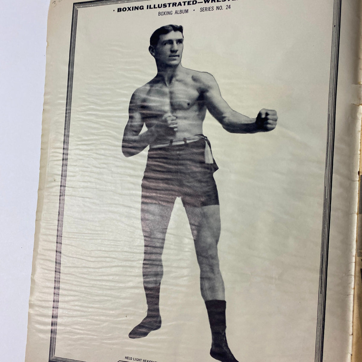 Historical black and white photo from Boxing Illustrated Magazine featuring an unnamed boxer in shorts, highlighting the boxing album section from the September 1961 issue.