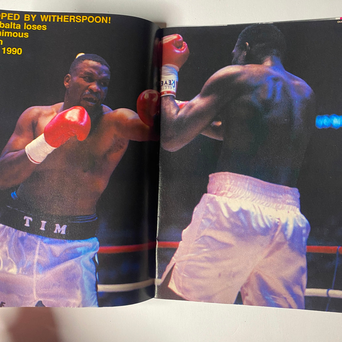 Inside Boxing Magazine No. 4 featuring a dramatic boxing match between two fighters, showcasing the intensity and skills of the sport.