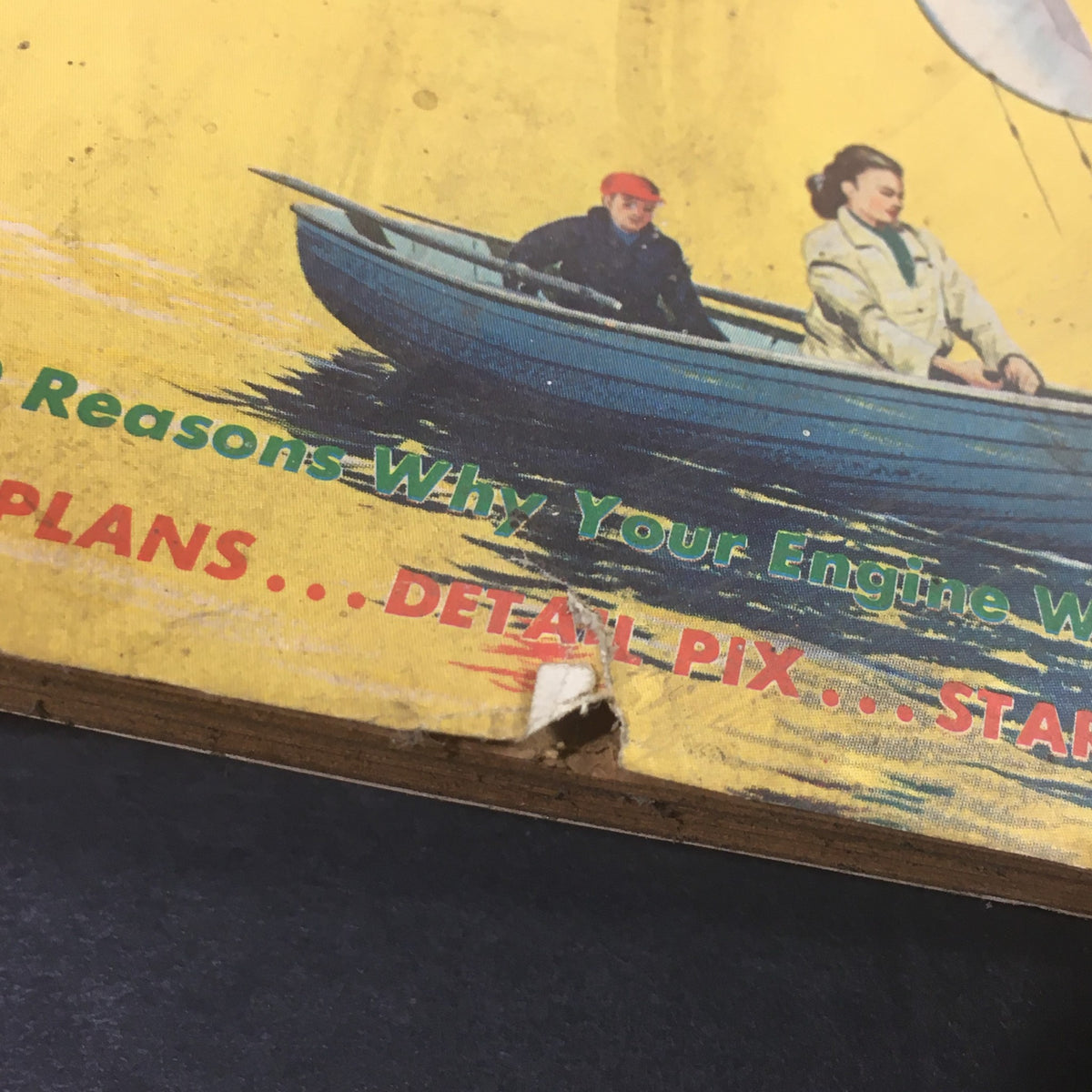 Close-up detail of the cover of VTG American Modeler Annual 1961 Edition, showing wear and tear on the edge with a visual of a couple in a boat and promotional text about model plans and hints.