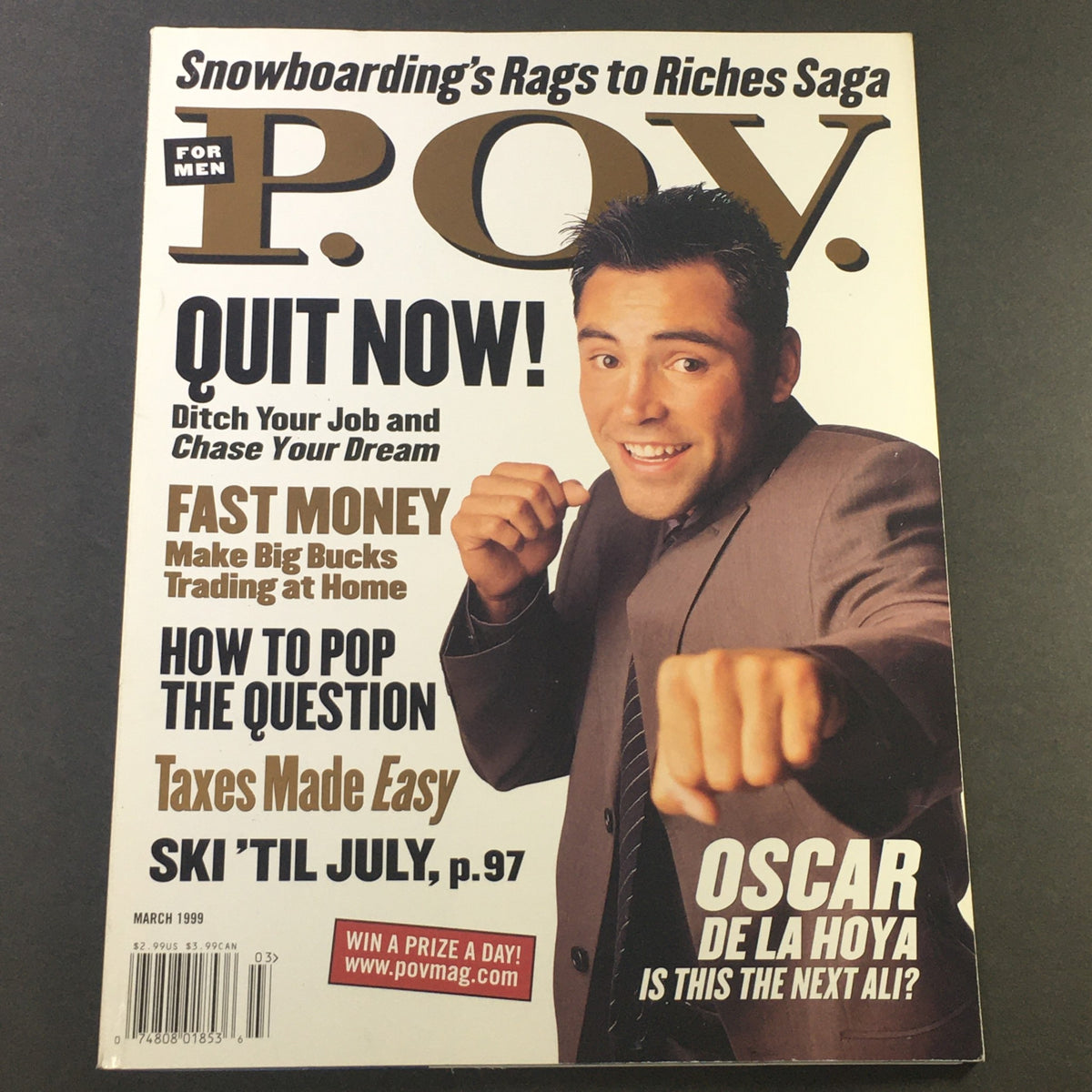 Cover of the March 1999 issue of POV For Men Magazine, featuring a photo of boxing champion Oscar De La Hoya promoting the theme "Snowboarding's Rags to Riches Saga" with headlines about financial tips and lifestyle.