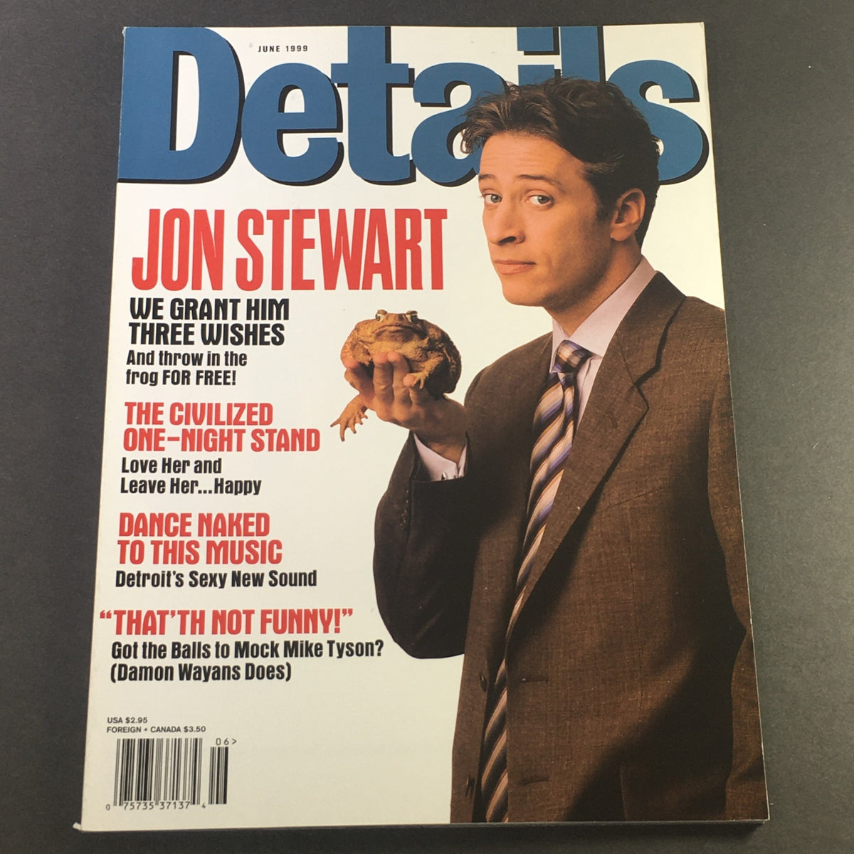 Details Magazine June 1999 cover featuring Jon Stewart holding a frog, showcasing the title 'We Grant Him Three Wishes'. This vintage magazine captures iconic pop culture moments from the late '90s.