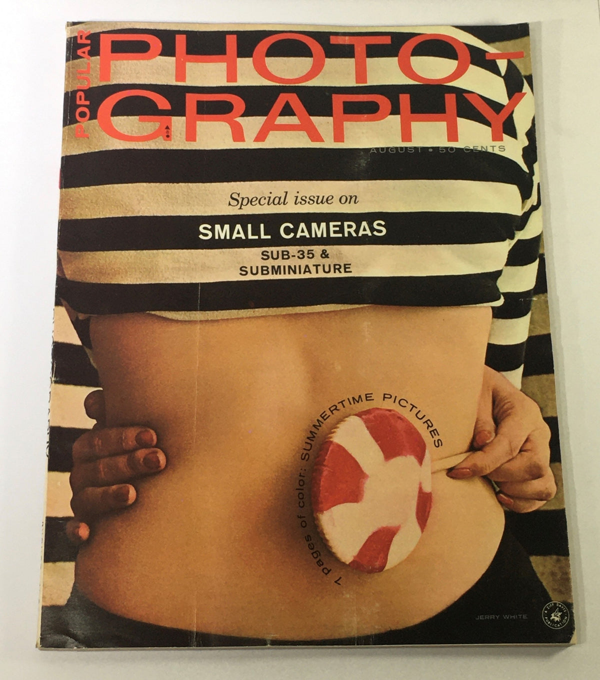 Cover of Popular Photography Magazine August 1963 highlighting small cameras categorized as Sub-35 and Subminiature. The cover features vibrant graphics and an artistic illustration.