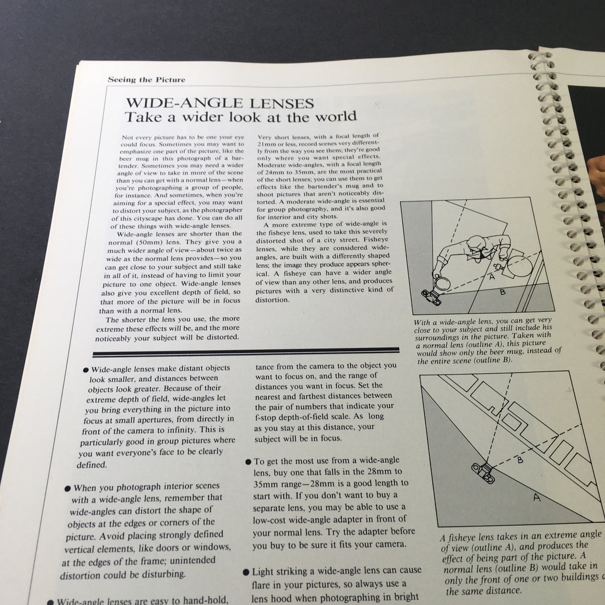 Wide-angle lenses section in '1982 The Camera Step-by-Step Handbook: How To Take Better Pictures', explaining techniques for capturing broader scenes.
