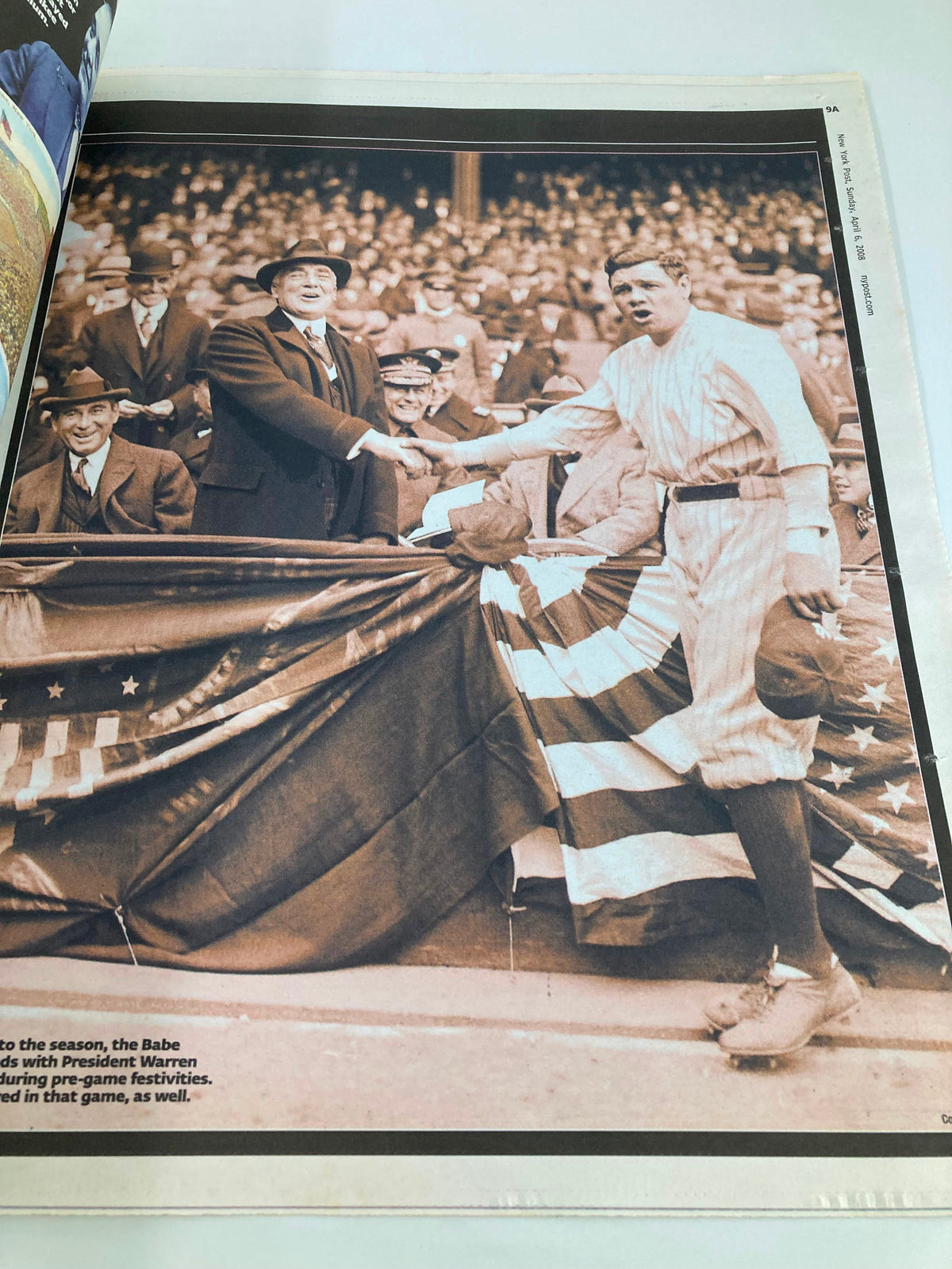 Historical photograph in the New York Post tribute 'The House That Babe Ruth Built,' depicting Babe Ruth greeting President Warren with an American flag backdrop.