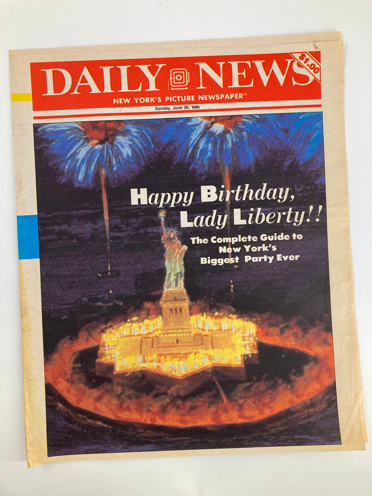 Front cover of VTG Daily News Newspaper from June 29, 1986, featuring a celebration of Lady Liberty's birthday with colorful fireworks backdrop and the Statue of Liberty illuminated. Complete Guide To New York's Biggest Party.