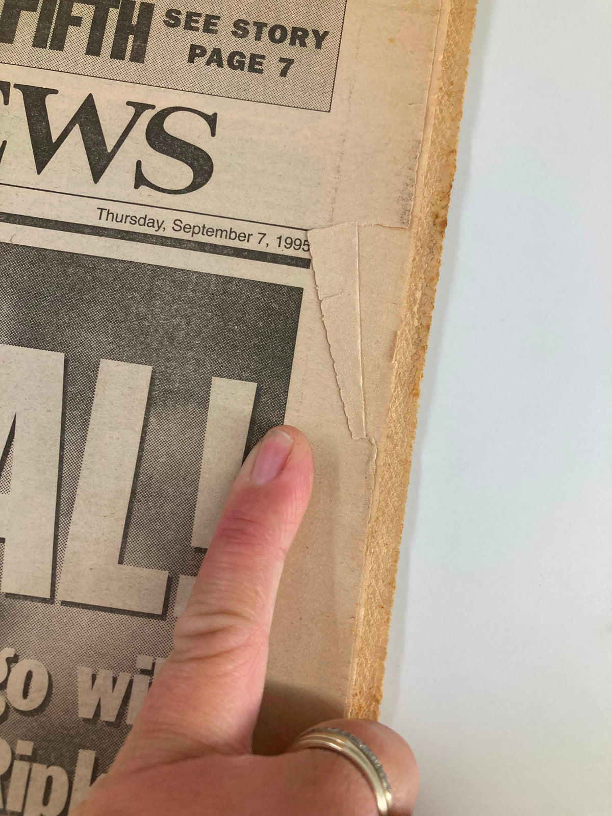 Close-up of the September 7, 1995 VTG Daily News Newspaper showing minor wear and tear on the edge, emphasizing its vintage condition featuring Cal Ripken.