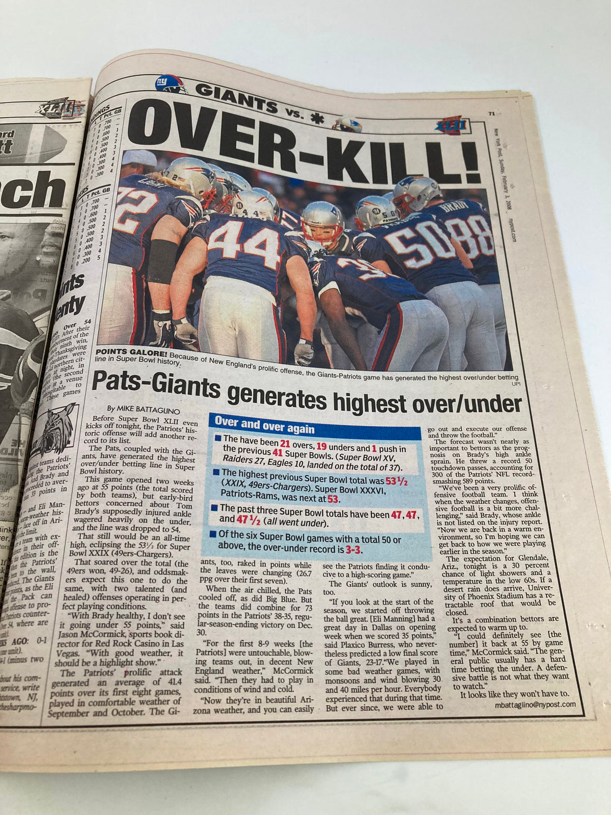 New York Post Newspaper, February 3, 2008, with an article titled 'OVER-KILL!' discussing the Giants vs. Patriots football game, featuring images of players on the field.