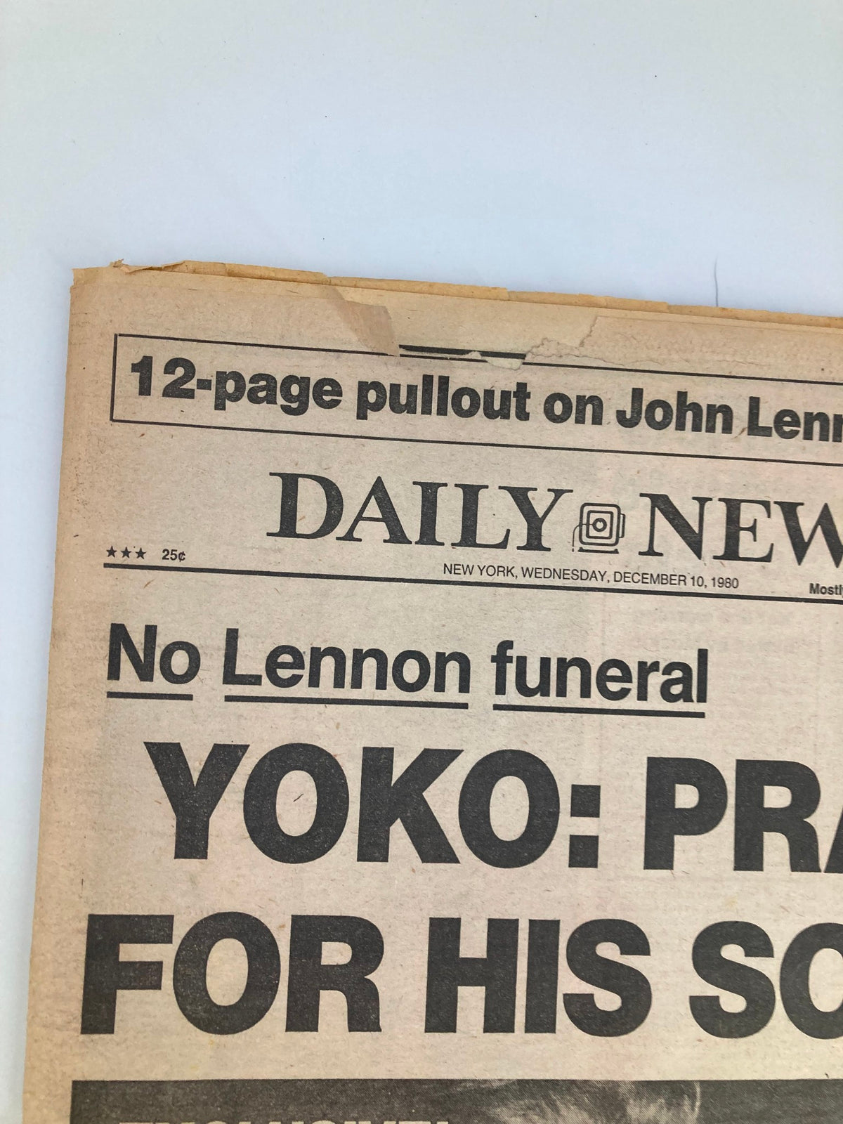 Close-up view of the VTG Daily News Newspaper December 10, 1980, highlighting the headline 'Yoko: Pray for His Soul' related to John Lennon.