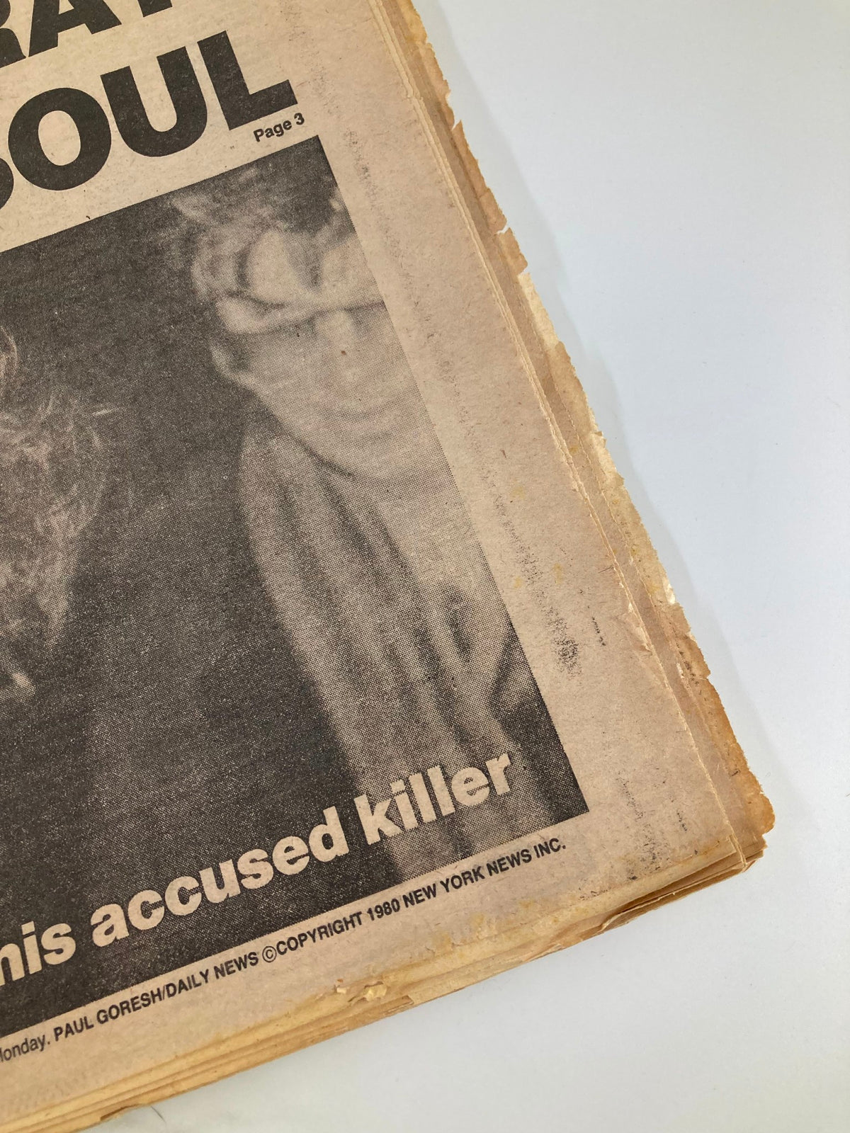 Detail view of the VTG Daily News Newspaper December 10, 1980, emphasizing the mention of 'John Lennon and his accused killer' in the publication.