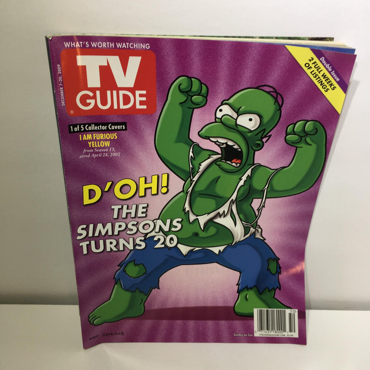 TV Guide December 7-20, 2009 cover featuring The Simpsons Turns 20, showcasing a vibrant illustration of Homer Simpson in an exaggerated pose celebrating the iconic animated series.