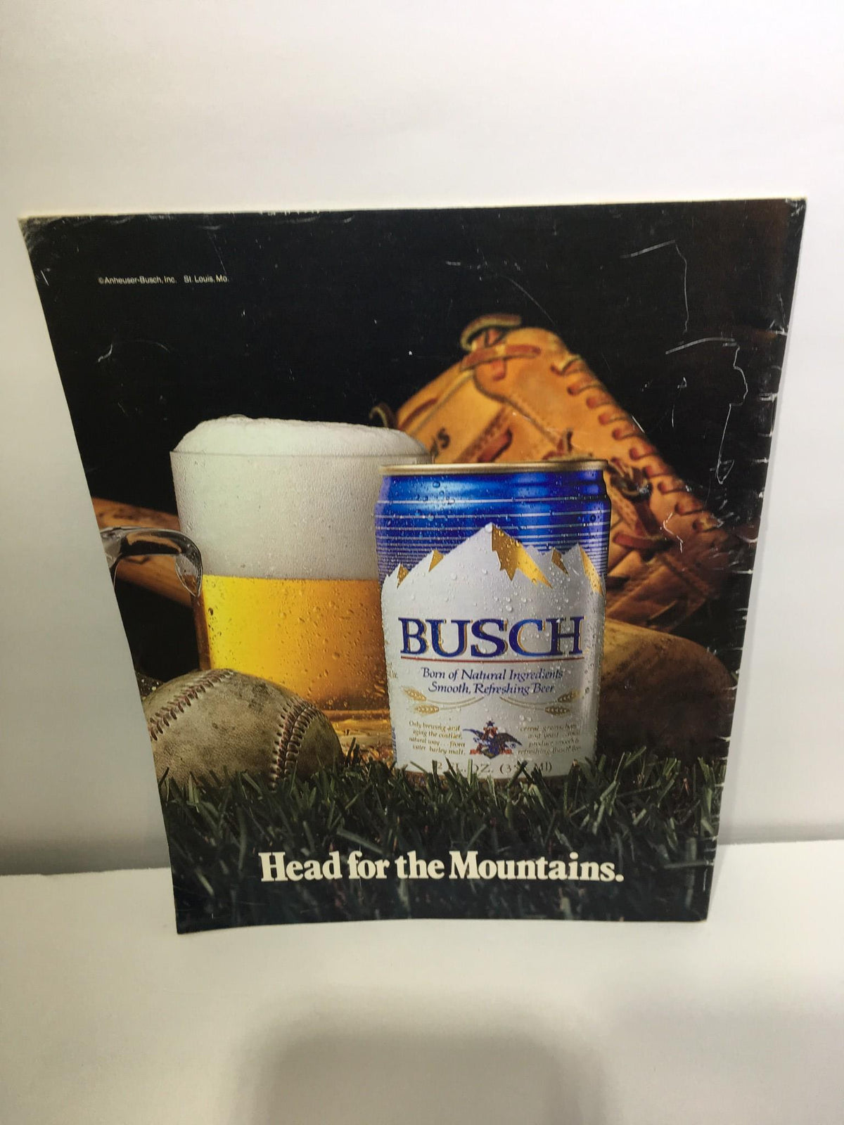 Back cover of the 1983 ALCS program displaying an advertisement for Busch beer with baseball paraphernalia, reinforcing the baseball culture of the era.