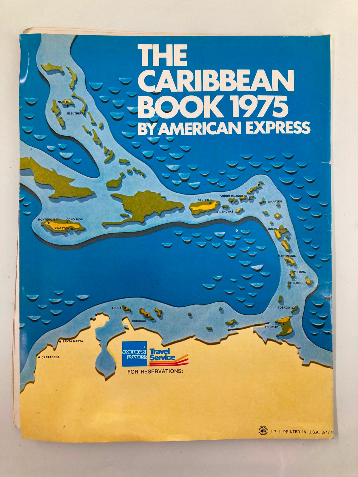 Map page from The Caribbean Book 1975 by American Express, highlighting the Caribbean region with artistic details for travel planning.