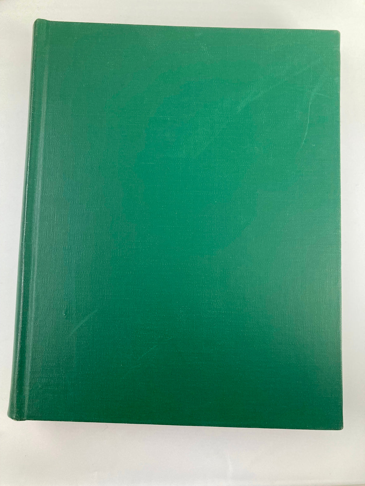 Top-down view of the library-bound VTG Esquire Magazine, featuring a smooth green cover indicating its vintage condition.