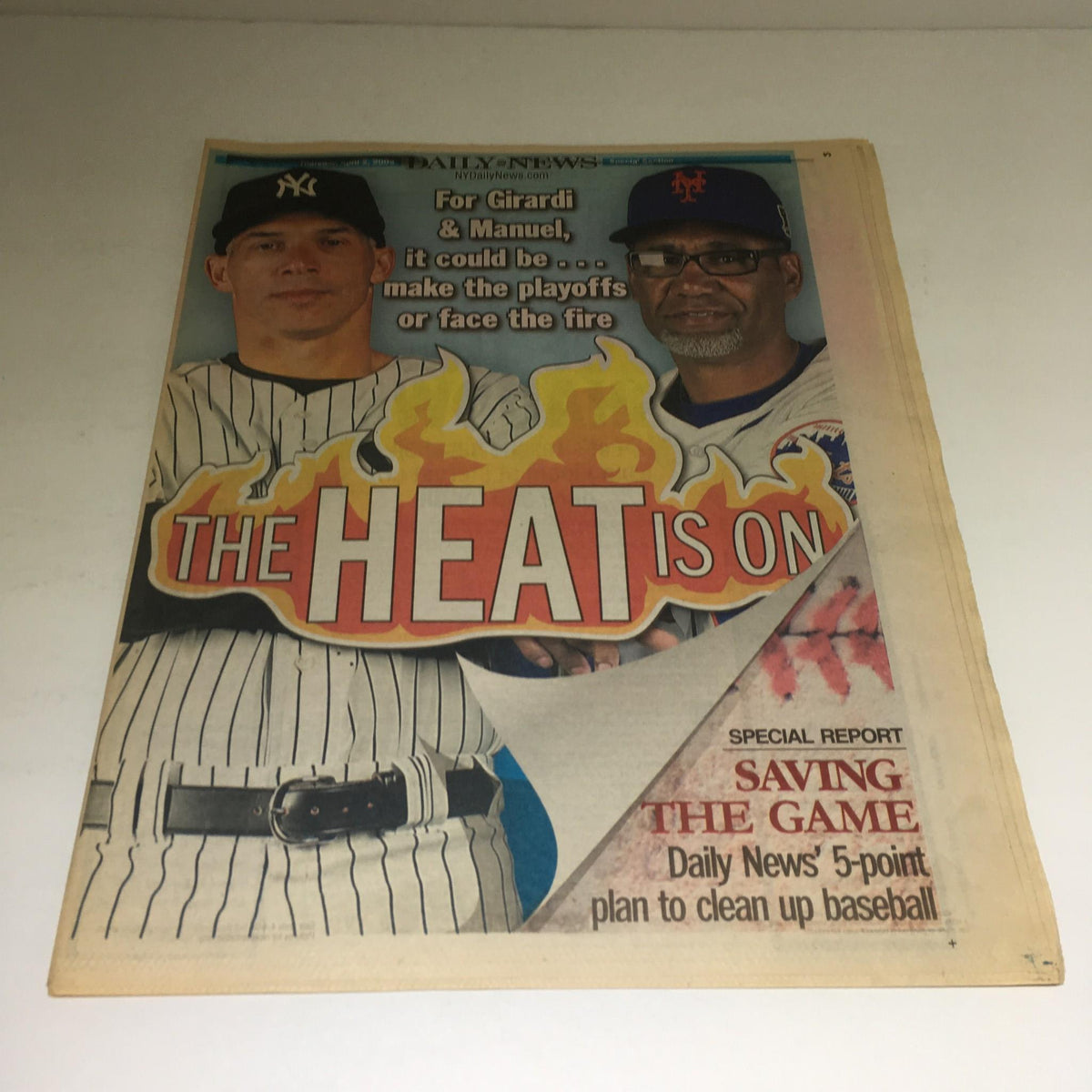 Cover of the New York Daily News titled 'The Heat Is On', dated April 29, 2009, featuring a graphic design with flames and images of baseball players, emphasizing the intense atmosphere of sports news.