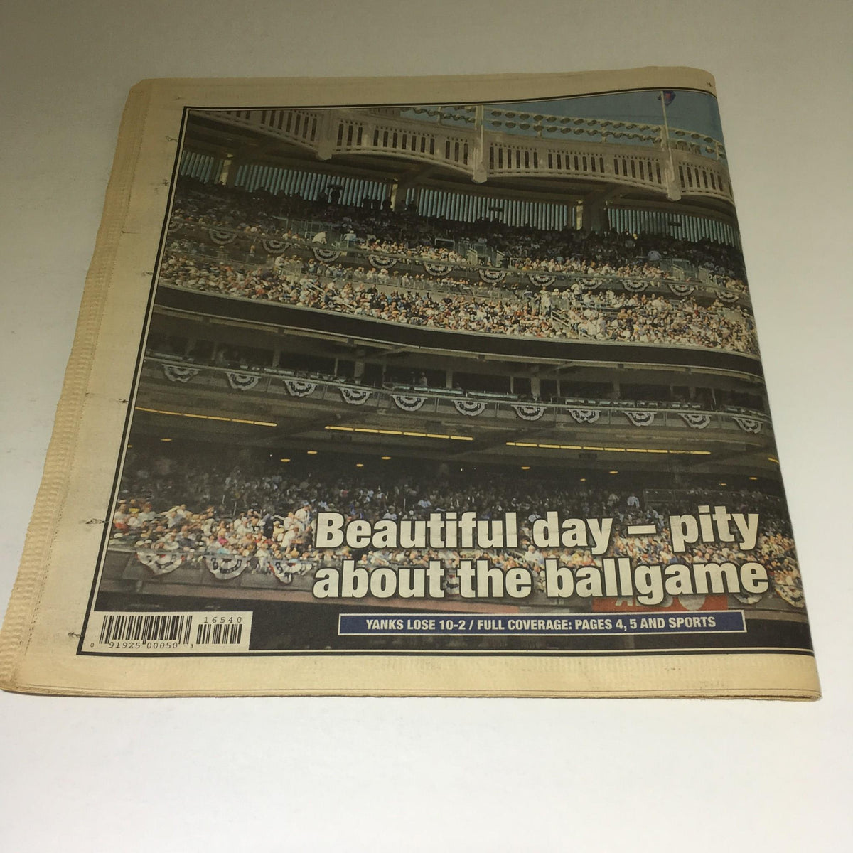 Back cover of the April 17, 2009 New York Post, featuring a photograph from the Yankees' opening day, with the headline addressing the game outcome.