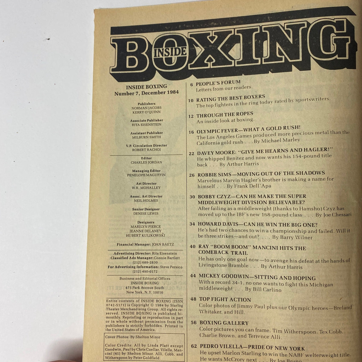 Inside Boxing Magazine December 1984, No. 7, with a contents page listing features like 'People's Forum' and 'The Olympic Fever' alongside other boxing articles.