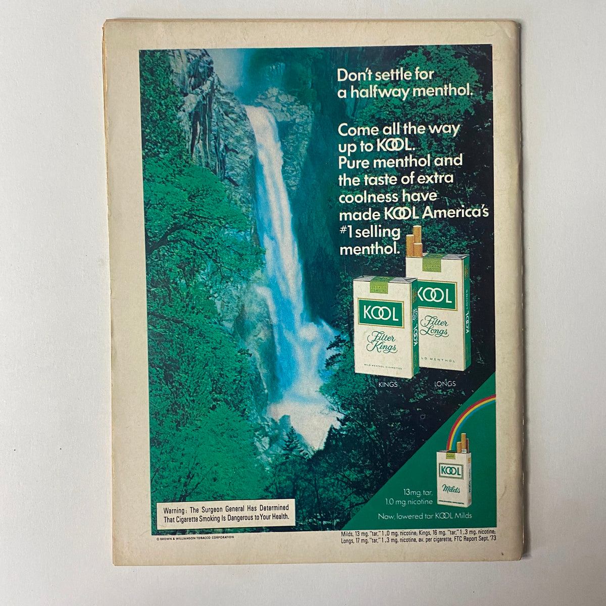 Back cover of The Ring Magazine July 1974 featuring an advertisement for Kool menthol cigarettes, emphasizing the product's refreshing appeal and the scenic beauty of nature.