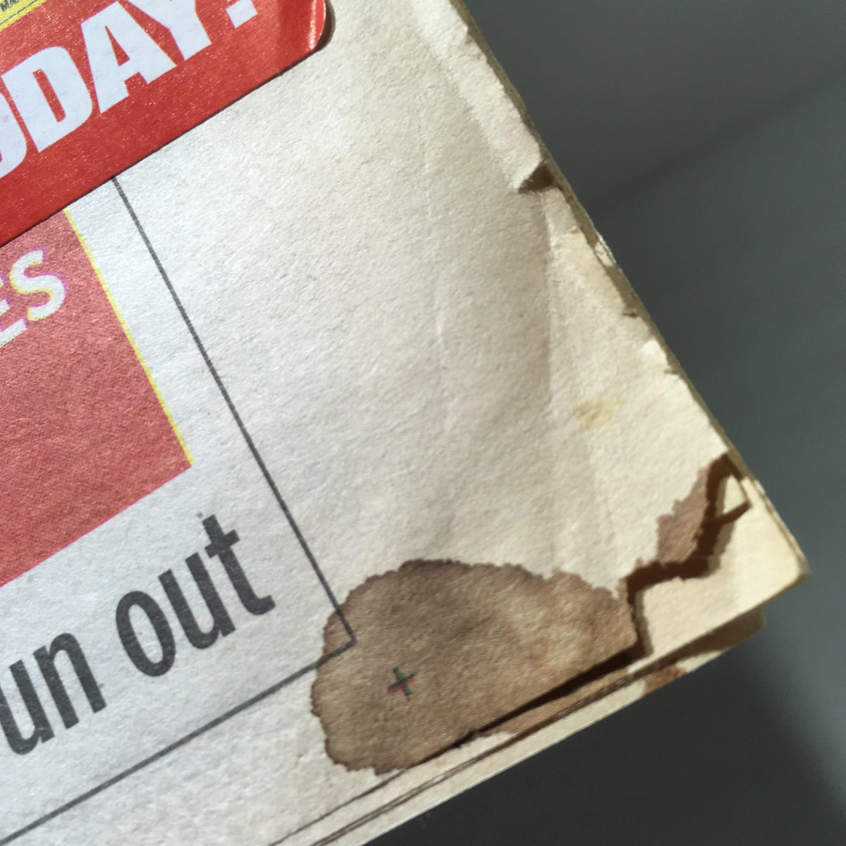 Close-up image of the corner of the New York Daily News cover from Nov 9, 2008, showing minor staining, indicating wear on the publication.