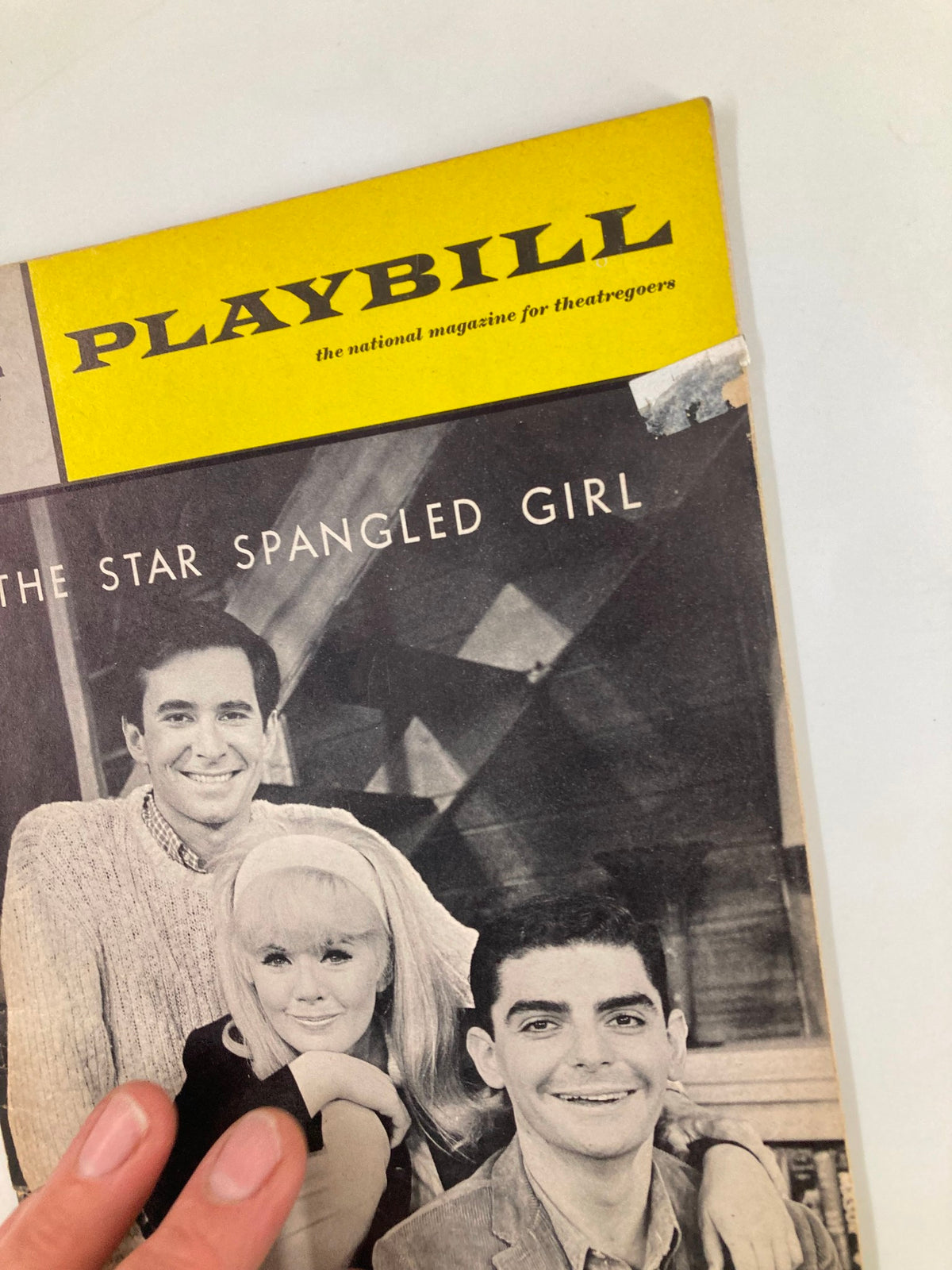 Close-up view of the 1967 Playbill for The Plymouth Theatre, highlighting the title The Star-Spangled Girl and featuring Anthony Perkins.