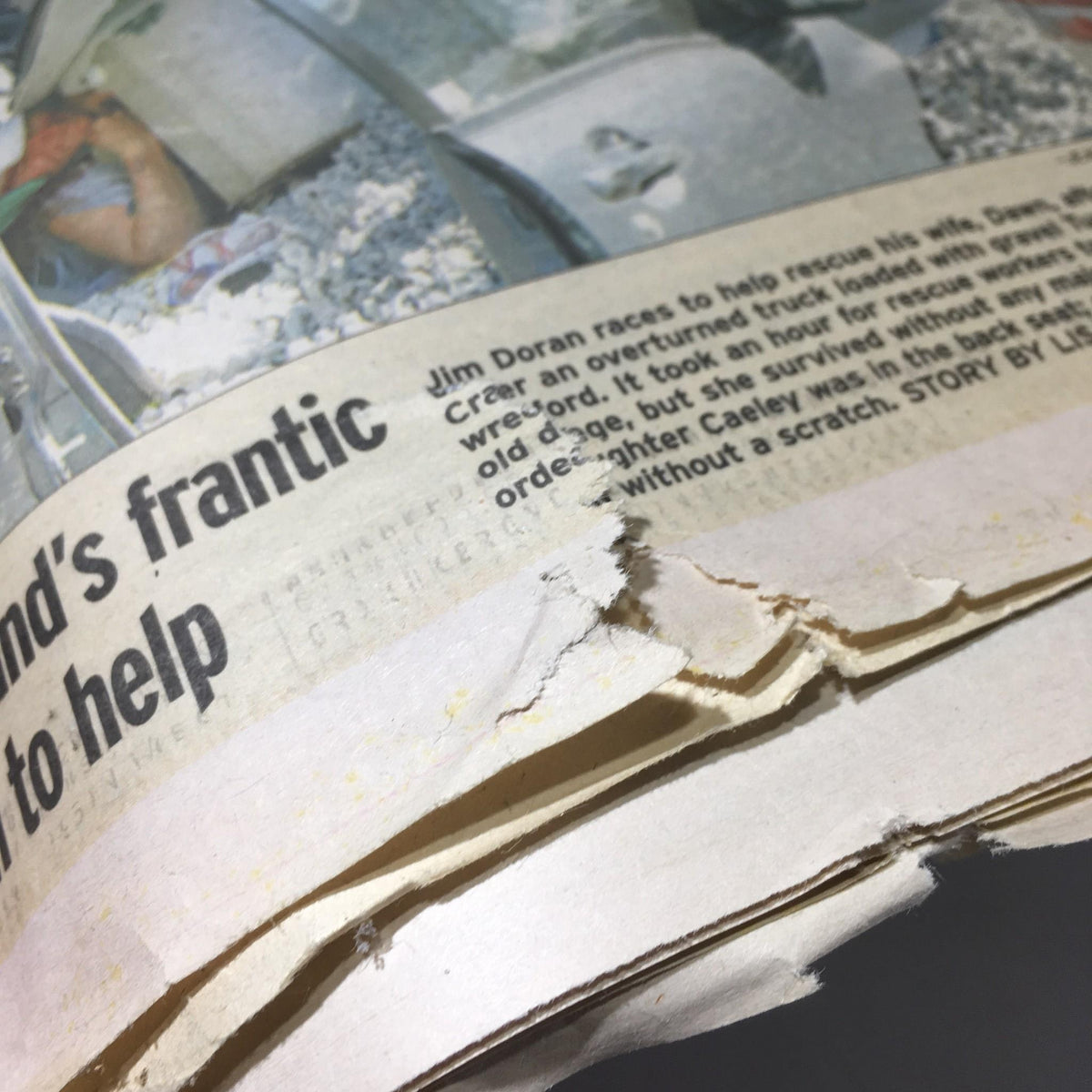Close-up view of a section of the Chicago Sun-Times newspaper with frayed edges, highlighting the article about the 'Miers Backed Abortion Ban' from Oct 19, 2005.