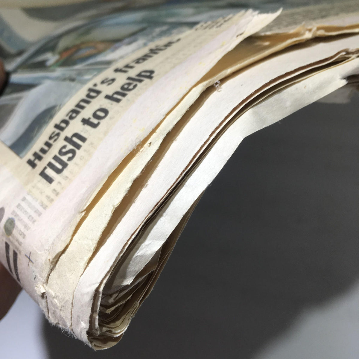 Side view of the stacked pages of the Chicago Sun-Times newspaper revealing creases, relevant to the issue dated Oct 19 2005, discussing 'Miers Backed Abortion Ban'.