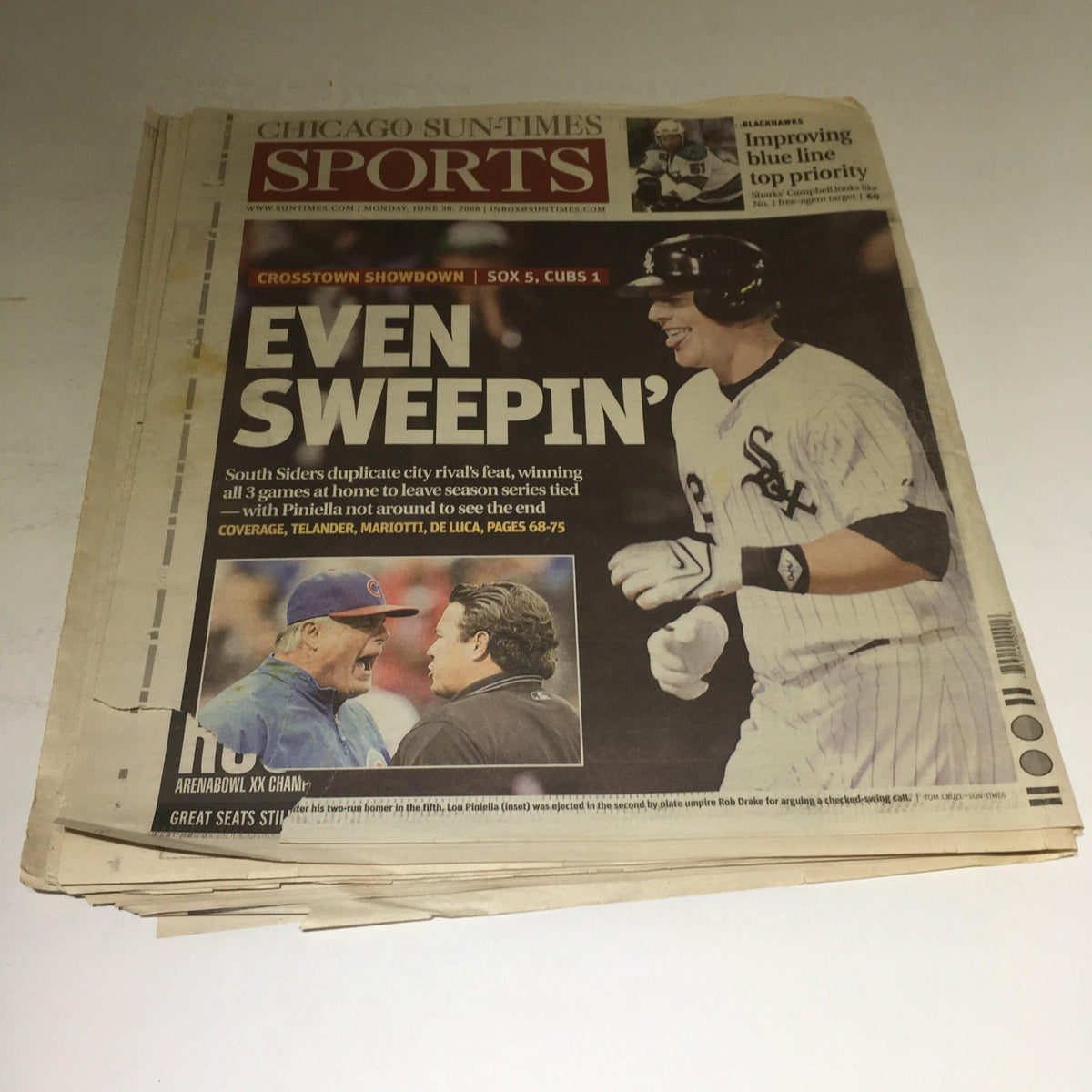 Interior page of the Chicago Sun-Times newspaper showcasing a sports article titled 'Even Sweepin’', detailing the Crosstown Showdown between Chicago baseball teams.