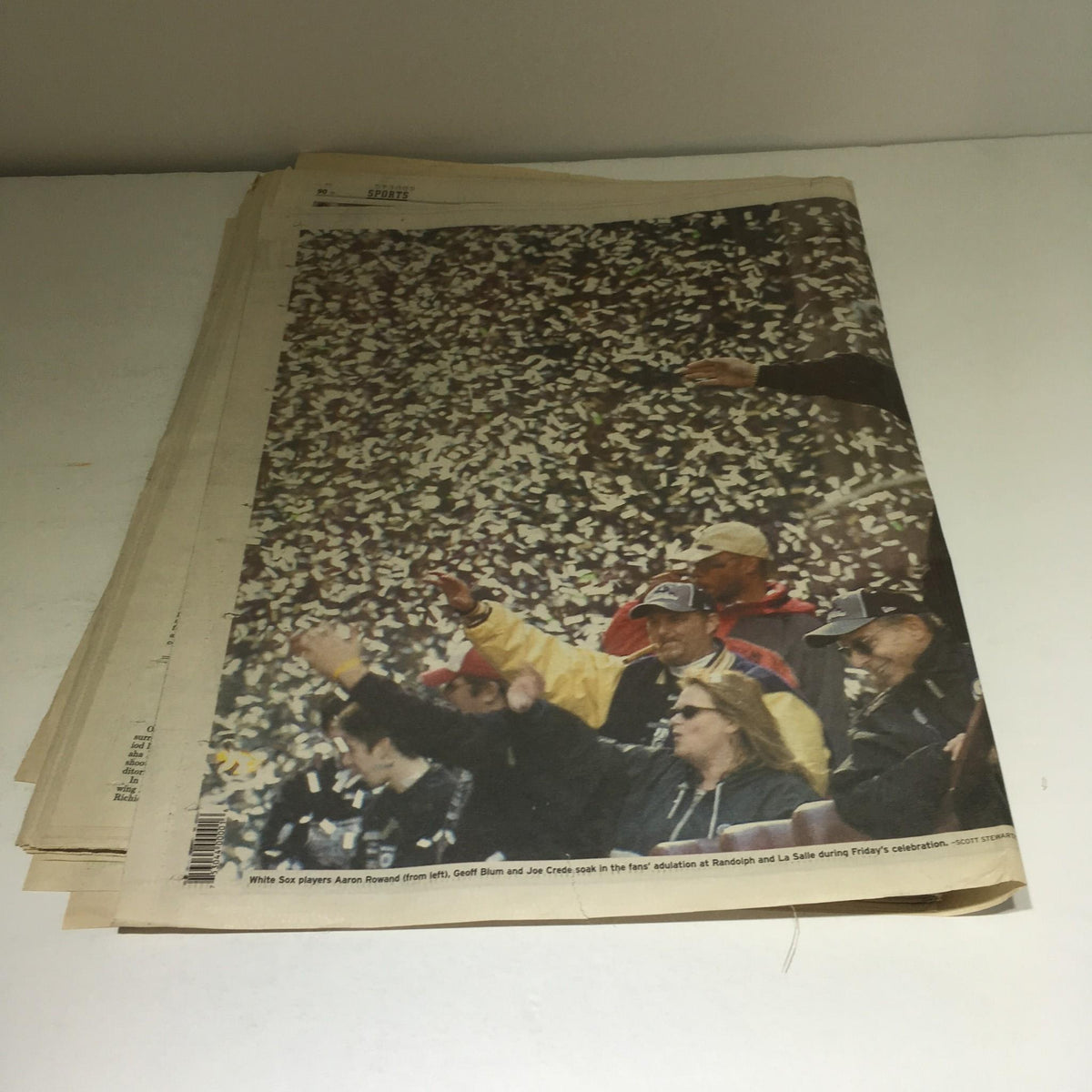 Chicago Sun-Times newspaper back view from October 29, 2005, featuring fans celebrating during the Chicago White Sox victory parade amid a shower of confetti.