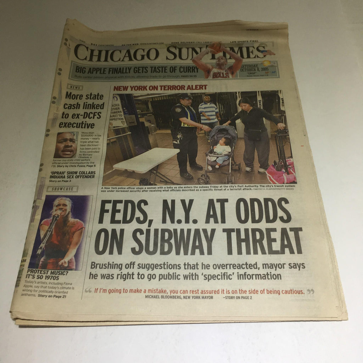 Chicago Sun-Times: Oct 8 2005 front page featuring headline 'Feds, N.Y. At Odds On Subway Threat' with a visual of law enforcement addressing a subway threat.