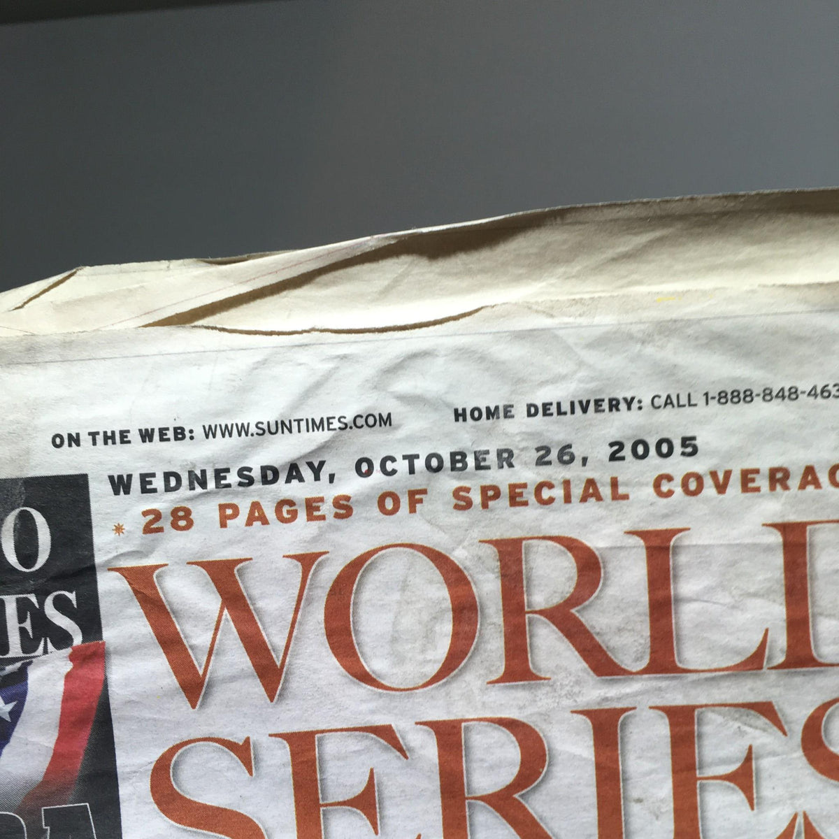 Close-up of the Chicago Sun-Times: Oct 26, 2005 newspaper showing the date and details of special coverage for the World Series.
