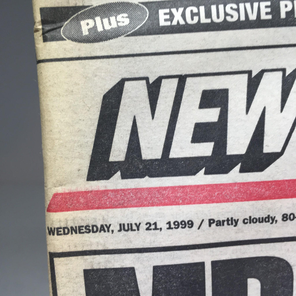Close-up of New York Post publication date July 21, 1999, featuring the headline 'Mr. Perfect Beans Hill'.