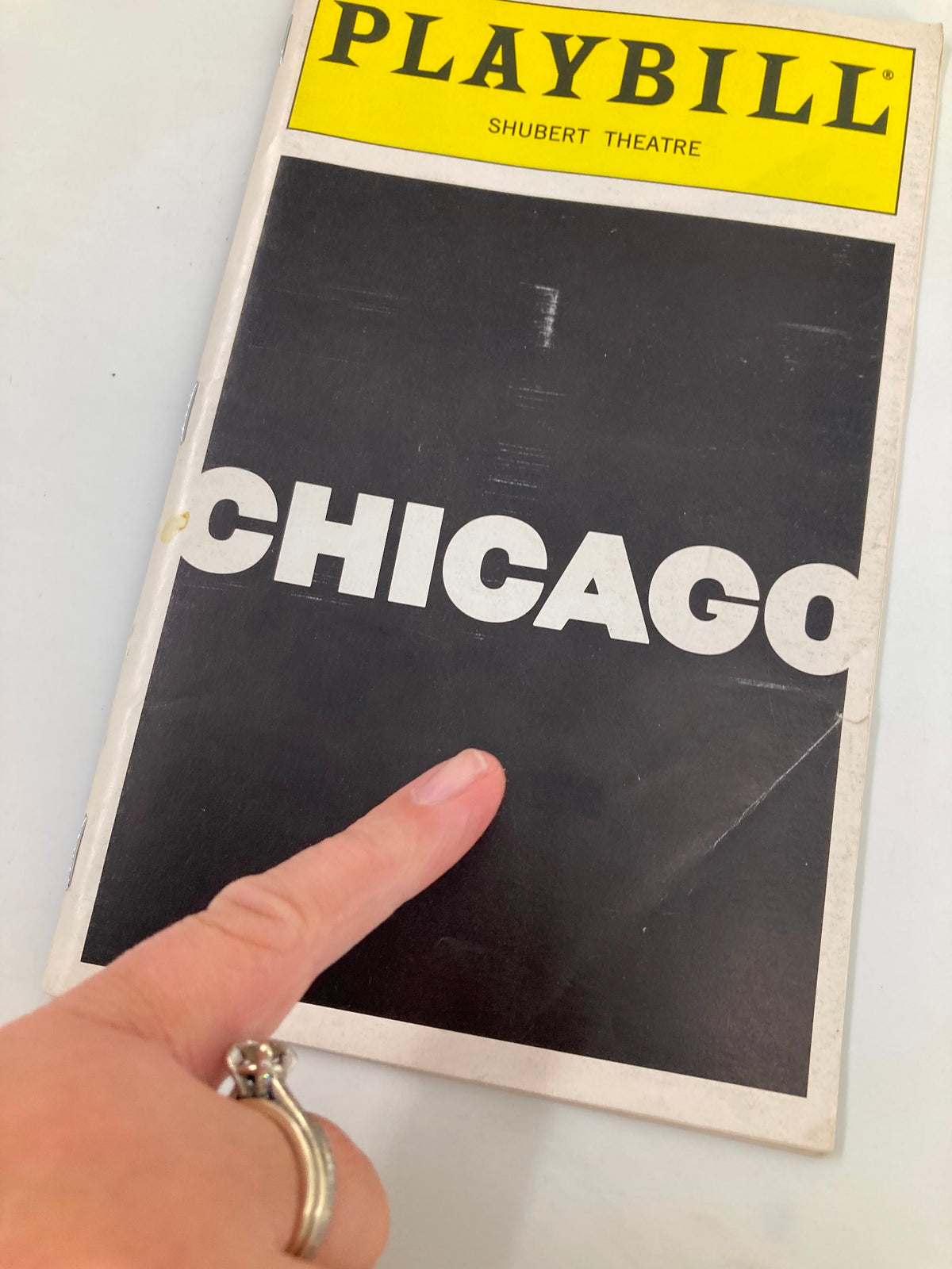 Close-up of the 1997 Playbill for Chicago at the Sam S. Shubert Theatre, highlighting the cover design with the title 'CHICAGO'.