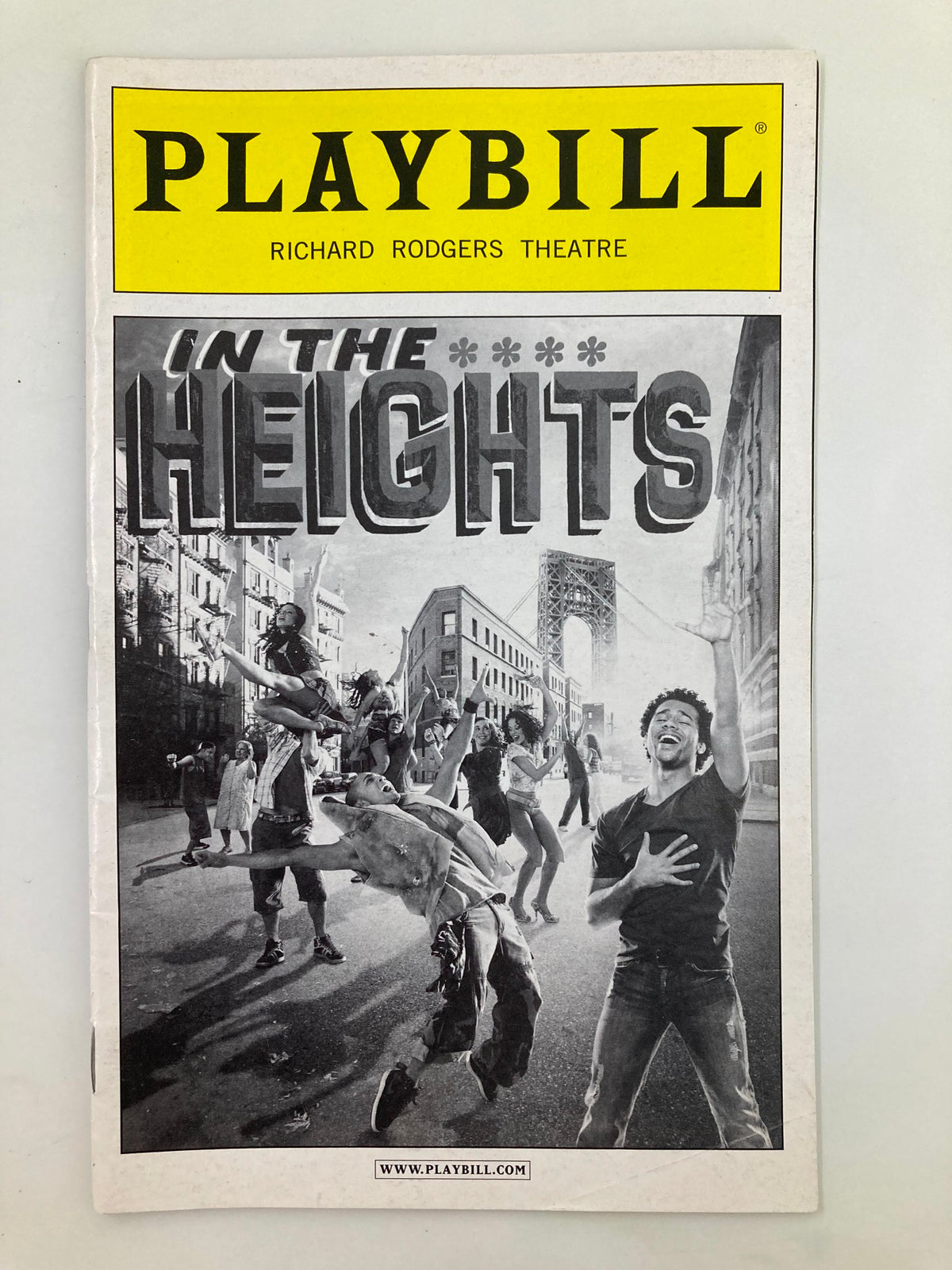 2010 Playbill for In The Heights at Richard Rodgers Theatre featuring vibrant street scene with dancers and performers, highlighting Corbin Bleu and Andrea Burns.