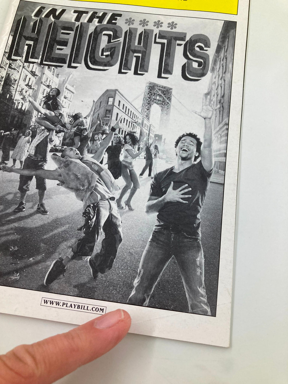 Cover of the 2010 Playbill for In The Heights at Richard Rodgers Theatre featuring lively street performance and Corbin Bleu.