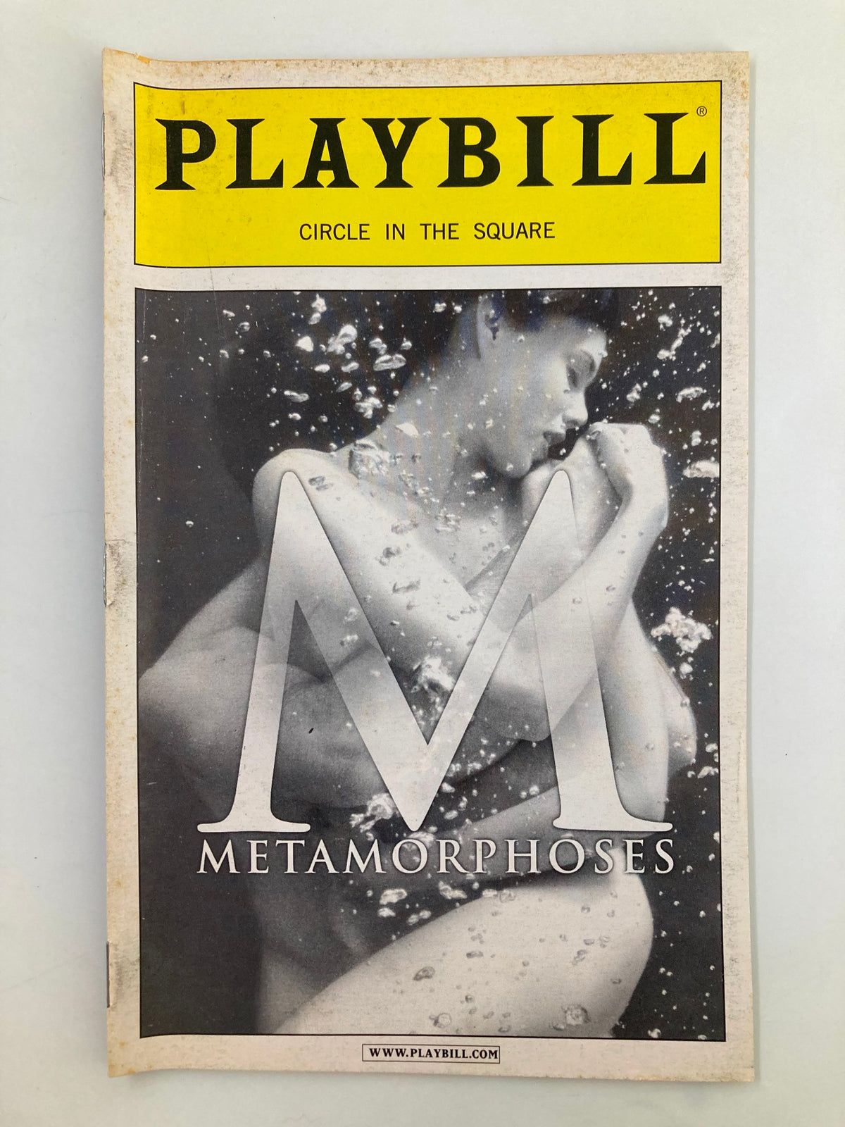 2002 Playbill for Metamorphoses at Circle in the Square Theatre showcasing a captivating cover design with underwater imagery and the letter 'M' prominently featured.
