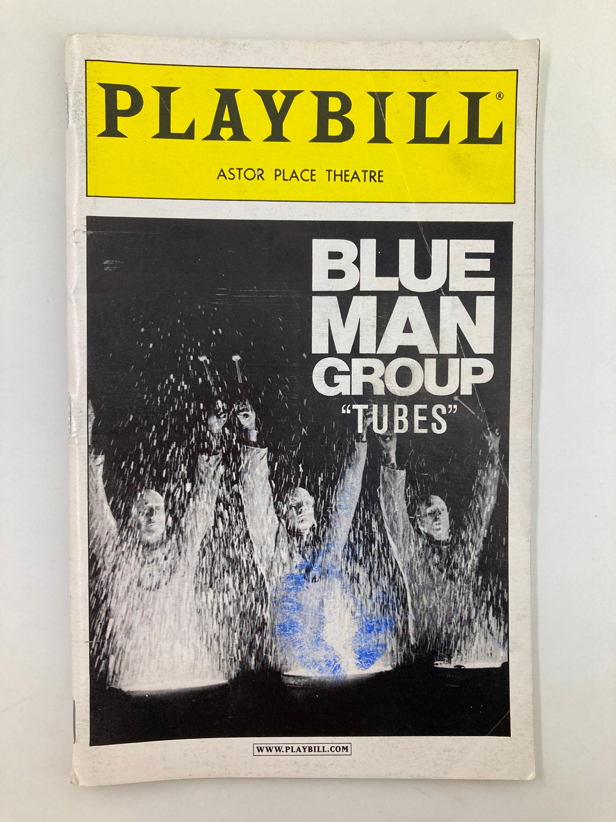 2000 Playbill for Blue Man Group 'Tubes' at Astor Place Theatre featuring the iconic performance with characters creating a visual spectacle.