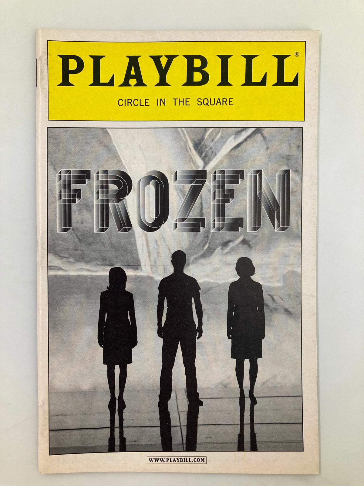 2004 Playbill Circle in the Square Frozen featuring the show's title in bold print with silhouettes of three characters.