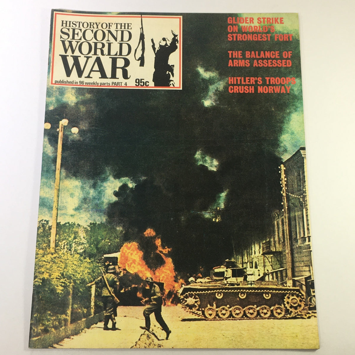 Cover of the magazine 'VTG History of the Second World War Part 4 1973 - The Capture of Fort Eben-Emael' featuring a dramatic scene with fire, military vehicles, and a soldier, highlighting significant events from World War II.