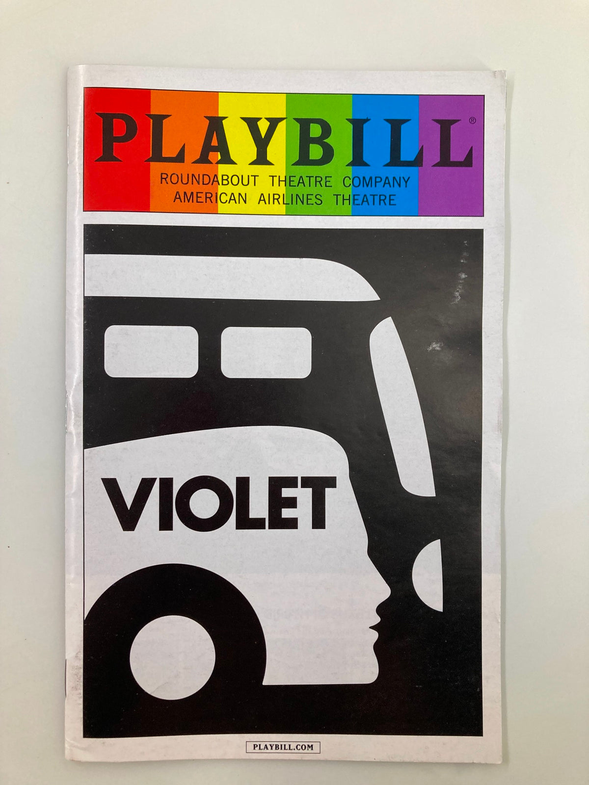 2014 Playbill for Violet at American Airlines Theatre featuring a striking design with the word 'VIOLET' and a silhouette.