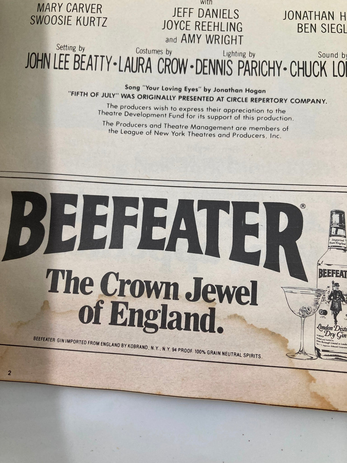 Advertisement for Beefeater Gin from the 1981 Playbill for 'Fifth of July,' showcasing a classic drink promotion.