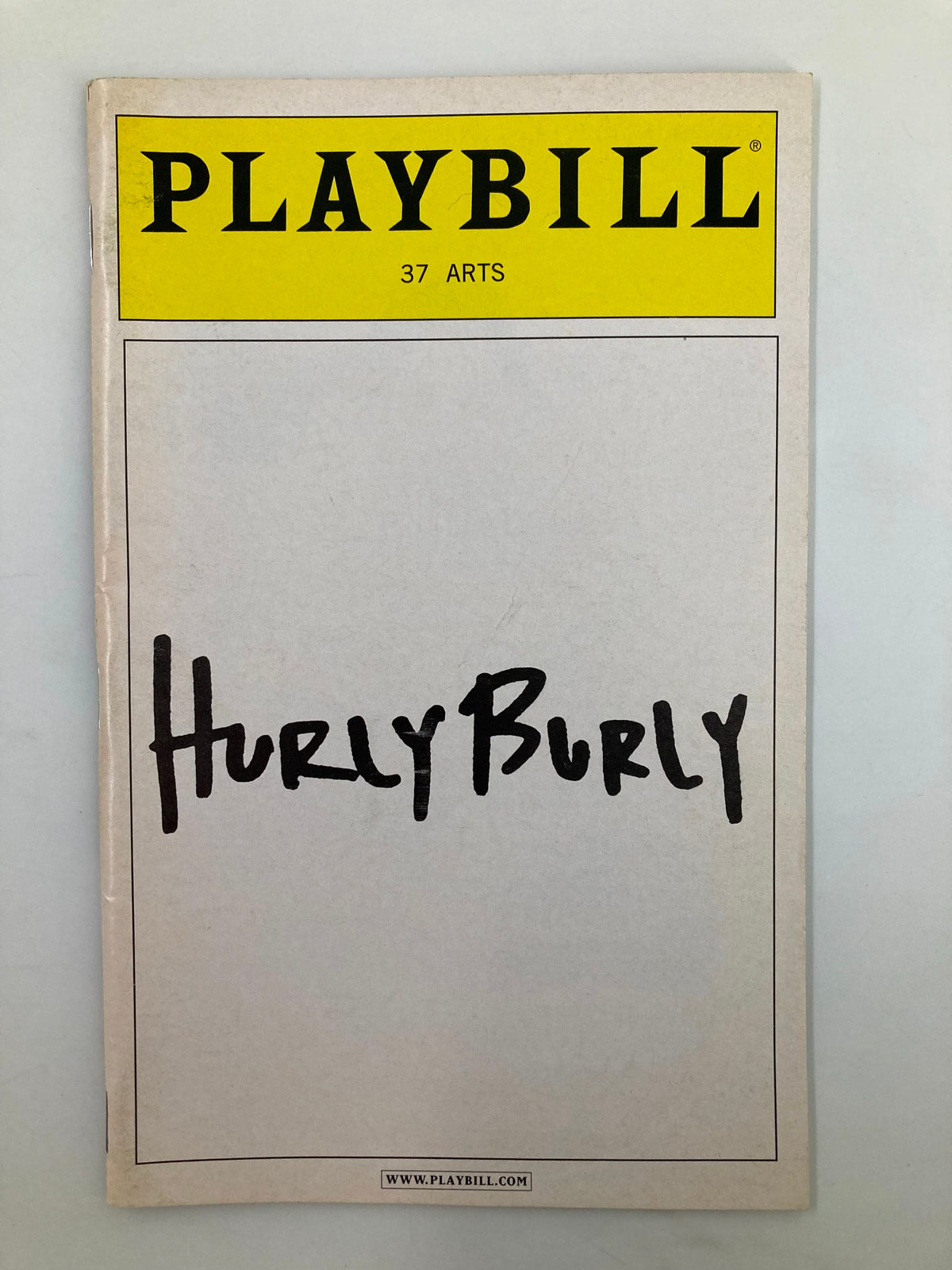 2005 Playbill for Hurly Burly featuring a minimalist design with the title prominently displayed in bold lettering.